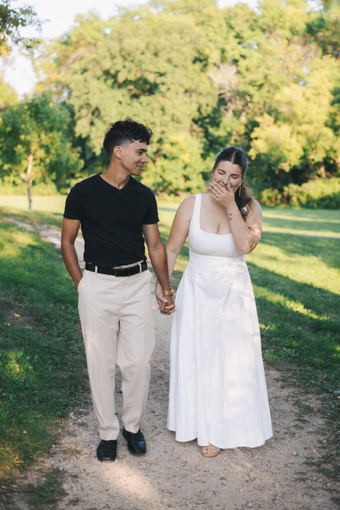 Couple walking through king park while laughing