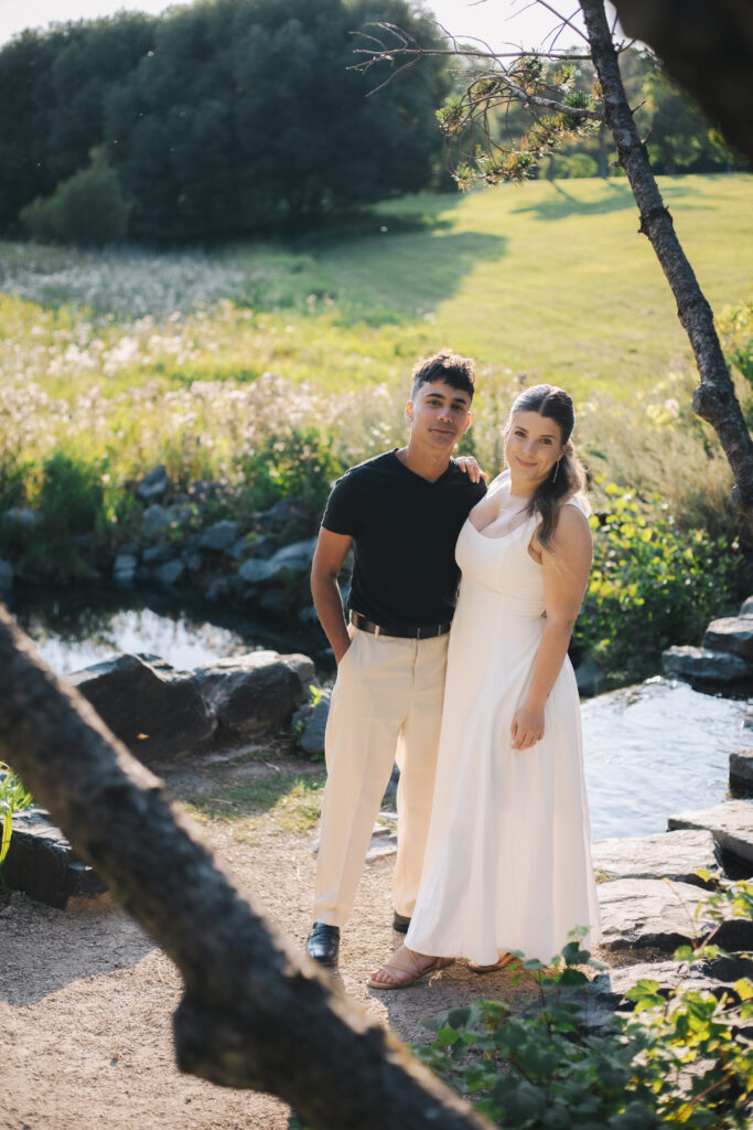 Couple standing infront of stream of water