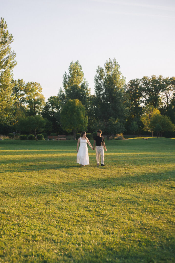 Couple walking across field