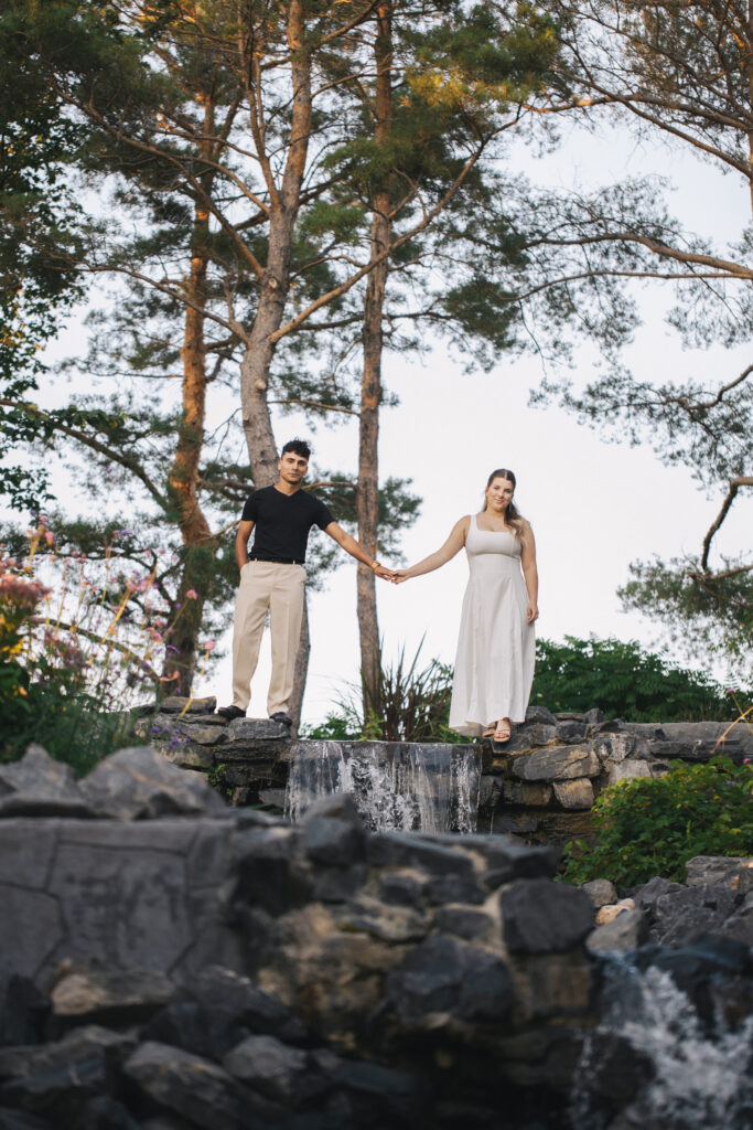 Holding hands over a waterfall